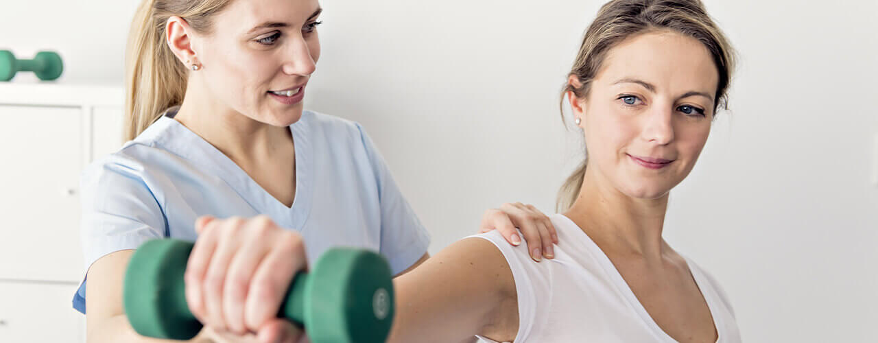 A lady getting her shoulder treated